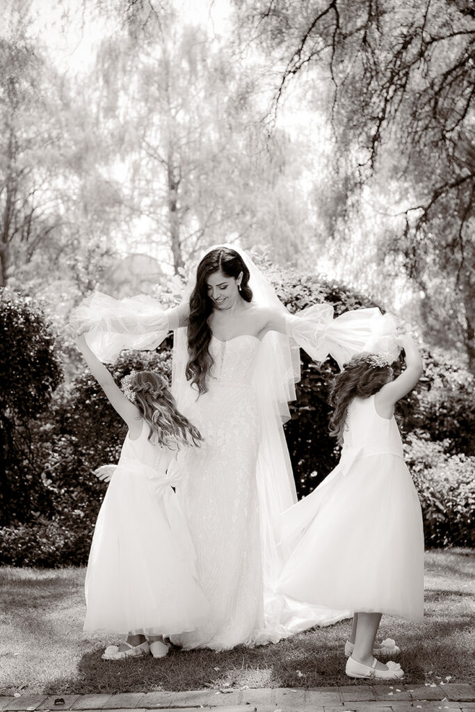 Candid moment black and white for S&B wedding by Kevin Mark Pass Photography, bridal makeup by Storm Pass